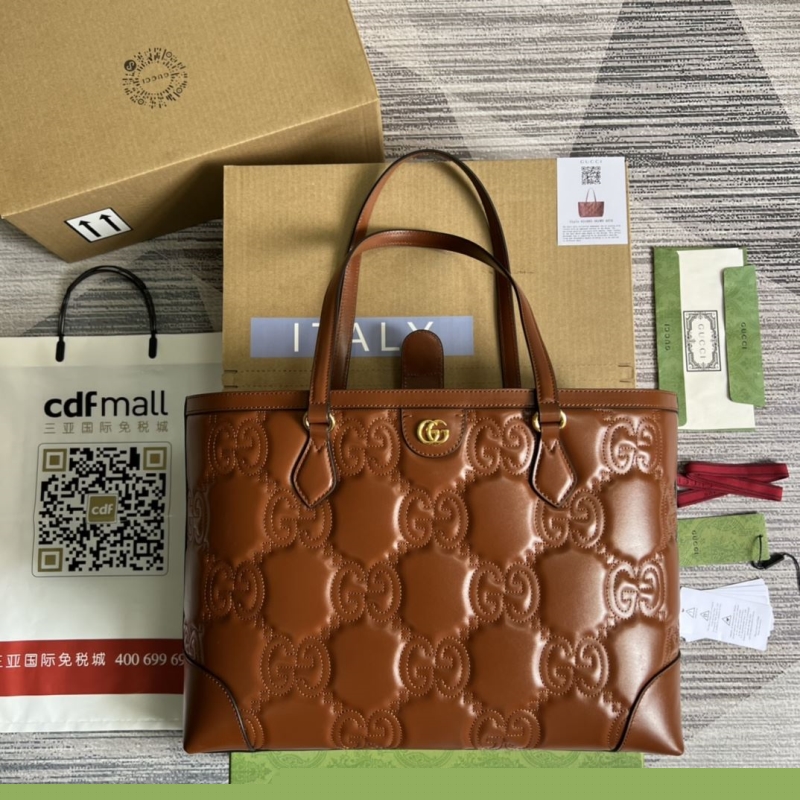 G*u*i shopping bags